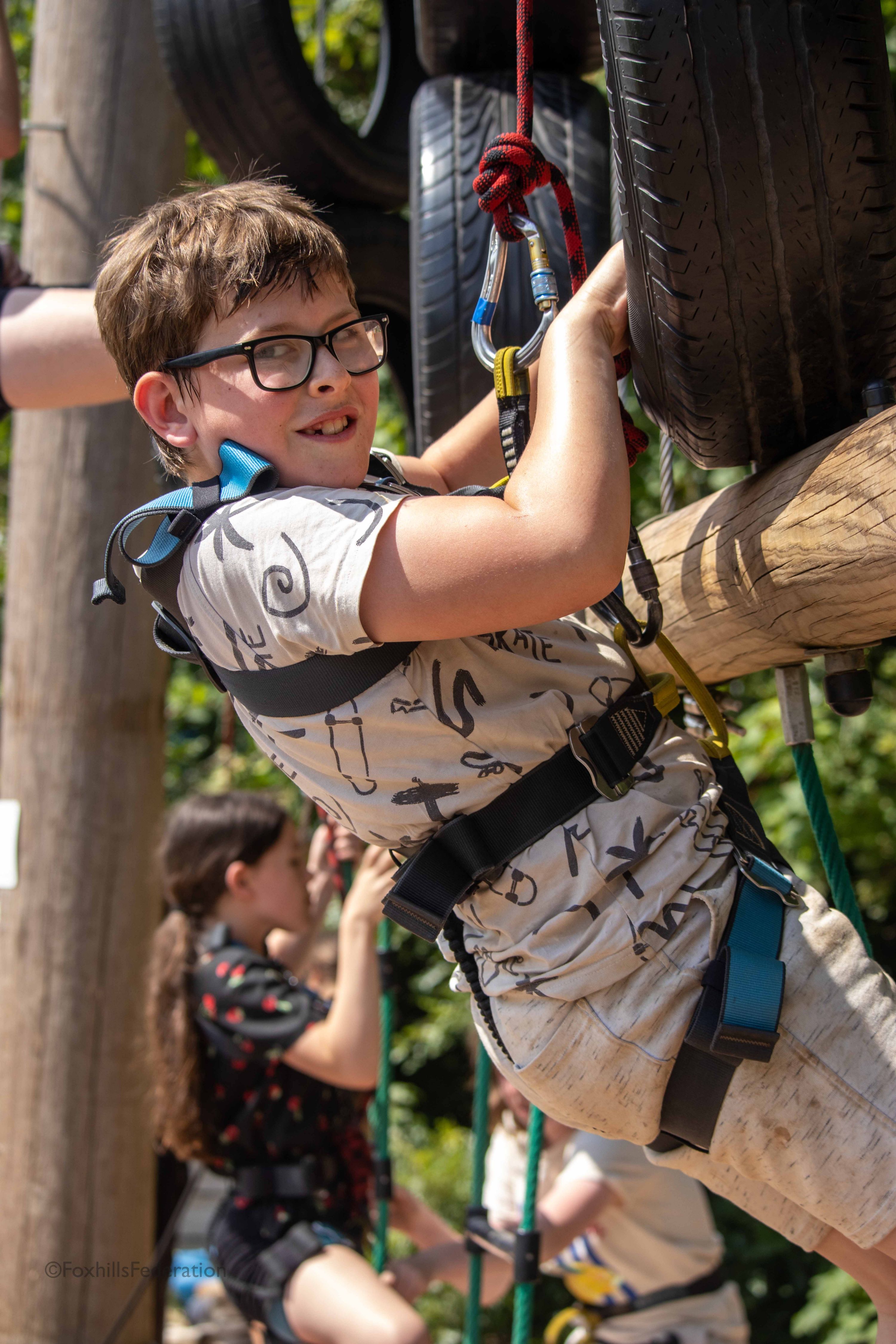 A boy climbs up a tower